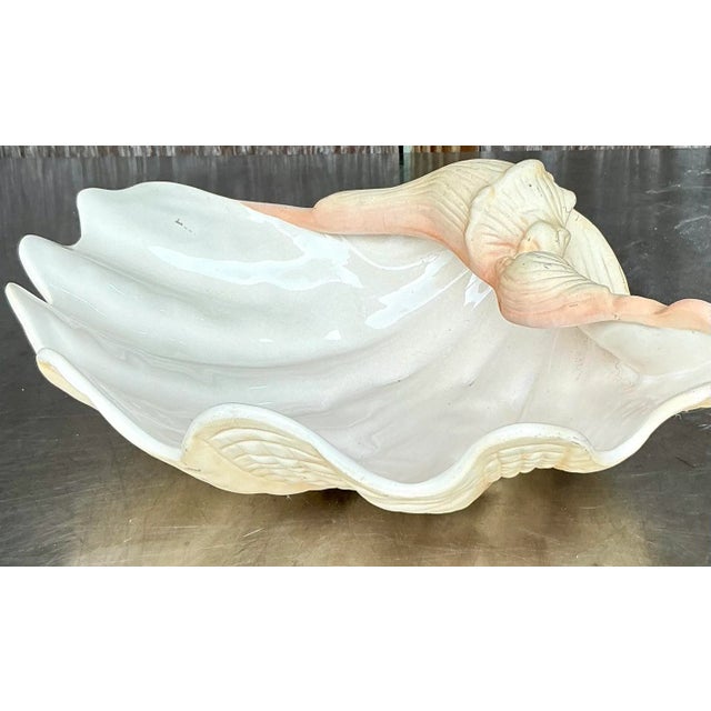 Bring a touch of seaside elegance to your home with this Vintage Coastal Glazed Ceramic Clam Shell. Perfect for American-...
