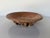 A striking 1980s studio pottery plate by Thomas Reece, showcasing the artist’s signature organic aesthetic and sculptural...