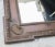 Edwardian wall mirror in wood. Wide panel frames with outer and inner egg and dart trims. Scalloped details on the corner...