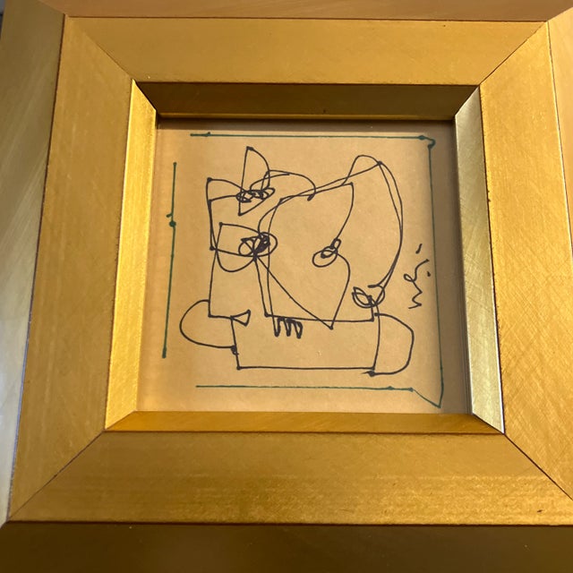 Original 4 x 4 ink drawing on yellow paper signed middle right Overall size with new old stock frame is 8 x 8