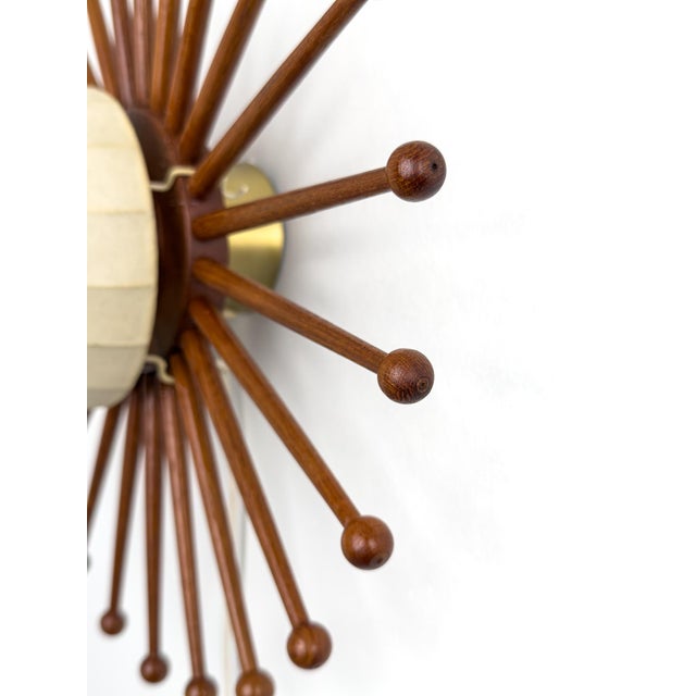 A sculptural wall lamp by Hans-Agne Jakobsson, produced in Markaryd during the 1940-1950s, exemplifying the refined...
