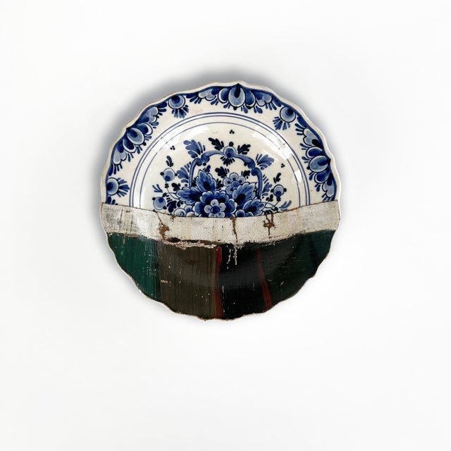 "Still Life in Red and Blue" consists of 6 plates combined with a painting of a bouquet in a light blue teapot on a bright...