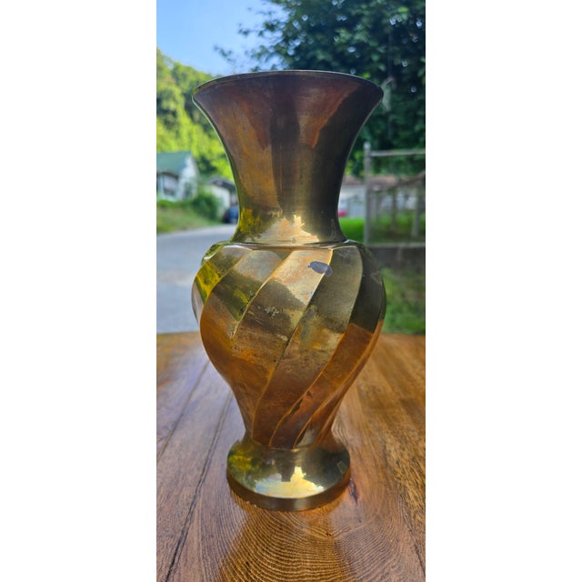 Add timeless sophistication to your décor with this striking vintage solid brass vase featuring a beautifully sculpted...