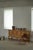 A charming low-profile sideboard crafted in oak and designed in the style of Henning Kjærnulf, Denmark, 1960s. The piece...