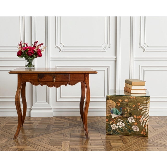 A striking Chinese Qing Dynasty style lacquer painted leather pigskin hide trunk or side table. The piece features a hand-...