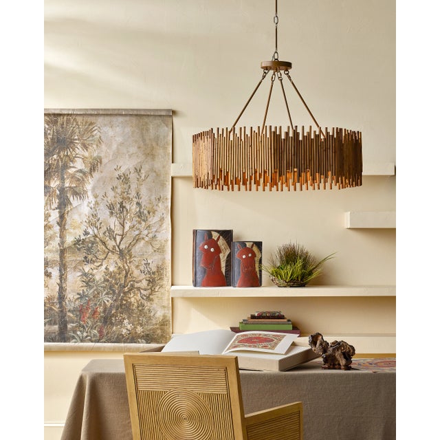 The shade of the Teahouse Chandelier is made of rattan ribs that are staggered top and bottom to bring the shape of the...