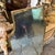 A shield shaped brass wall mirror designed and manufactured in Italy in the Sixties in the style of Giò Ponti, it's in...