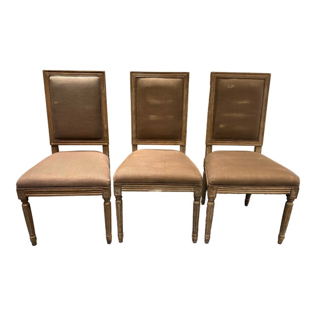 An elegant set of six French Louis XVI–style dining chairs by Restoration Hardware, featuring clean architectural lines,...