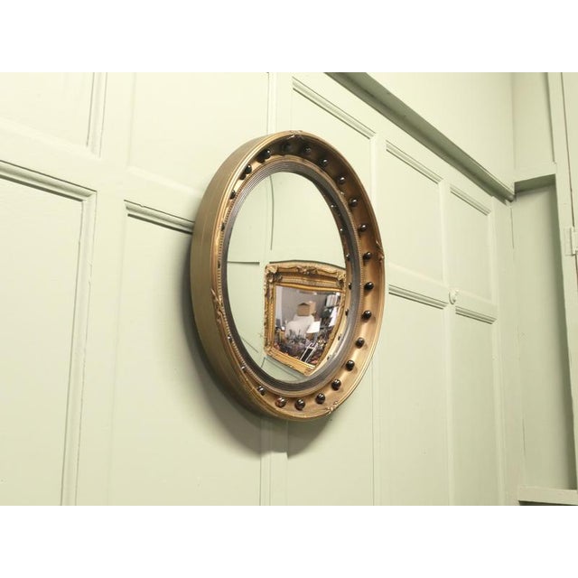 Gilt and Lacquer Regency Style Convex Wall Mirror This is a very attractive Mirror it has a 3” wide Black Lacquer and Gilt...