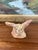 This imaginative hand-built ceramic sculpture depicts a fantastical creature with oversized, upright ears and a wide,...