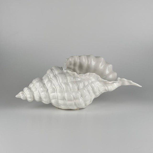 A large and highly decorative ceramic centerpiece in the form of a stylized seashell, designed by Alberto Smania for...