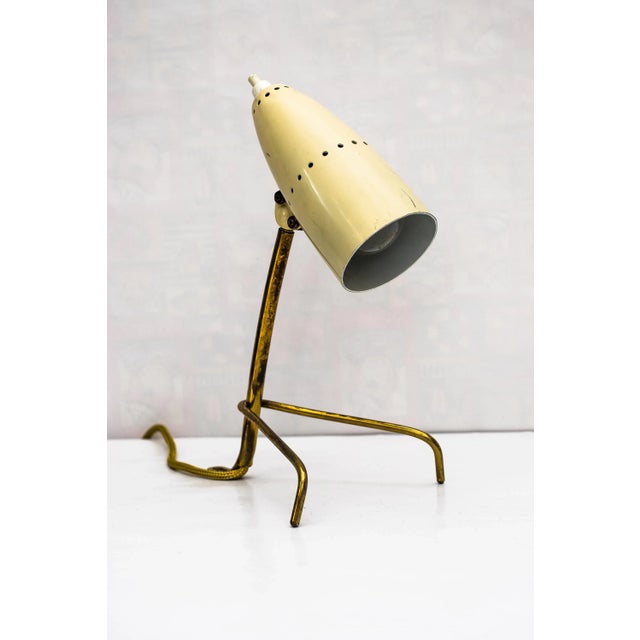 This table lamp from around the 1960s was produced by Rupert Nikoll, and is in original condition. I have official proof...