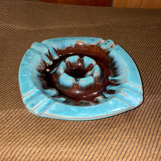 Blue and Brown drip glaze ashtray in excellent shape. Measures 7.25 x 7.25 x 1” tall. Mid century.