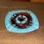 Blue and Brown drip glaze ashtray in excellent shape. Measures 7.25 x 7.25 x 1” tall. Mid century.