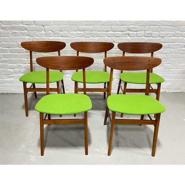 Rare set of five authentic Mid Century Modern dining chairs crafted in Denmark by Farstrup Møbler, c. 1960's. Designed...