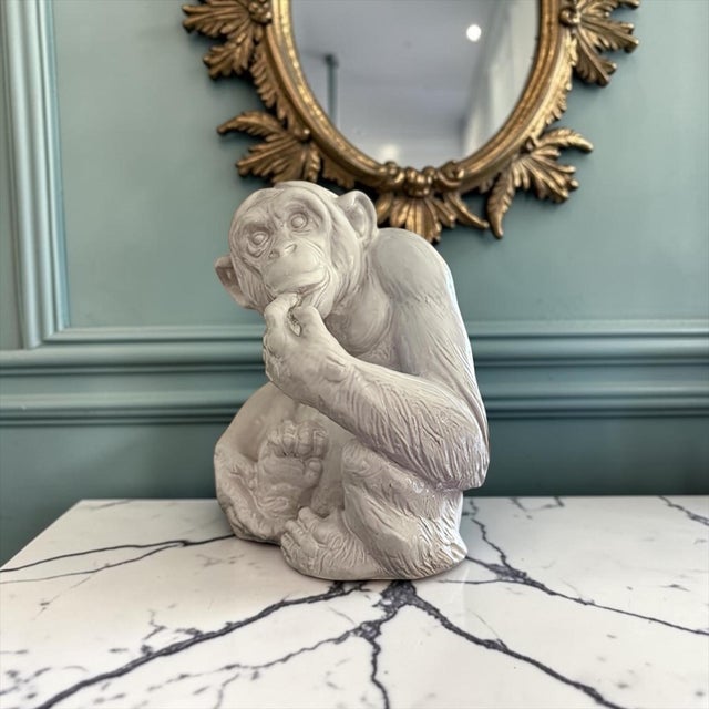 delightful vintage Italian glazed terracotta monkey sculpture featuring a thoughtful, contemplative pose reminiscent of...