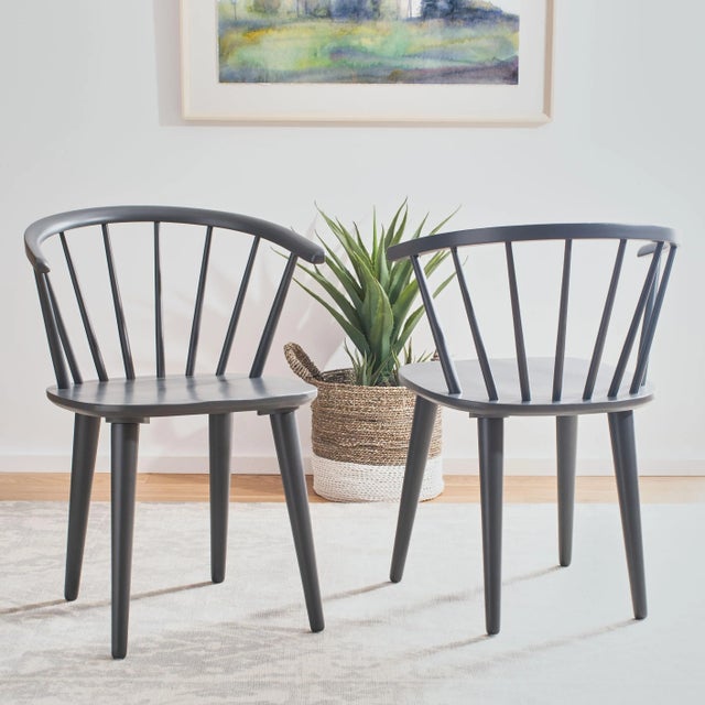 Inspired by the graceful curves of a antique captain’s chair, this set of two dining chairs is crafted of sustainable...