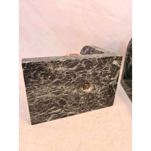 Pair of Art Deco Bookkeeping Books around 1930, representing a multicolored marble ball on a sea green marble base...