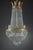 Large Empire-style hot-air balloon chandelier with tassels and ormolu mount with palmettes. It is lit by eight lights in...