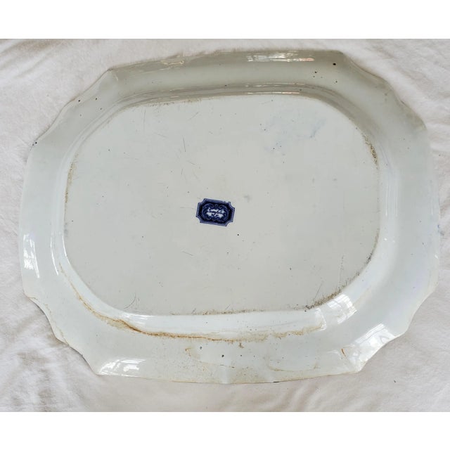 It's hard to deny that beautiful cobalt blue against the antique white! This piece is simply breathtaking. This huge flow...