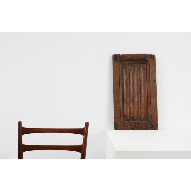 A finely carved oak relief panel from early 16th‑century France, showcasing the restrained elegance of late Gothic design....