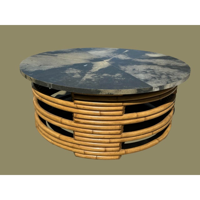 Packed away in storage for several years, is this vintage Ralph Lauren rattan coffee table with an impressive fossilized...