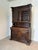 An impressive antique carved oak display cabinet showcasing exceptional craftsmanship and timeless elegance. Featuring...