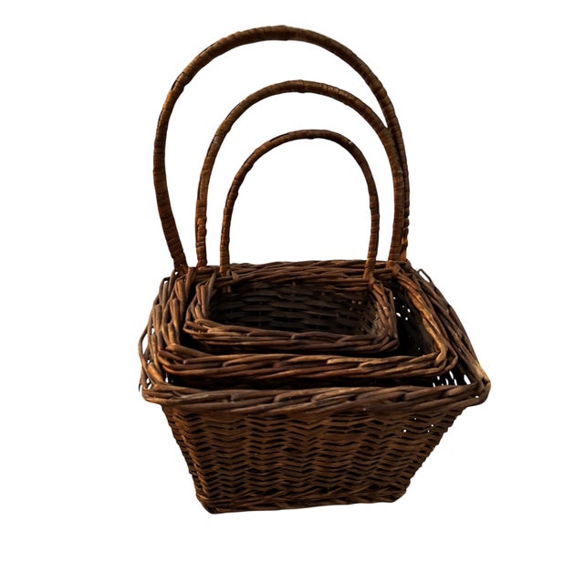 Likely made from split willow. Set of three nesting baskets. Would looks great on the wall in the kitchen or bathroom to...