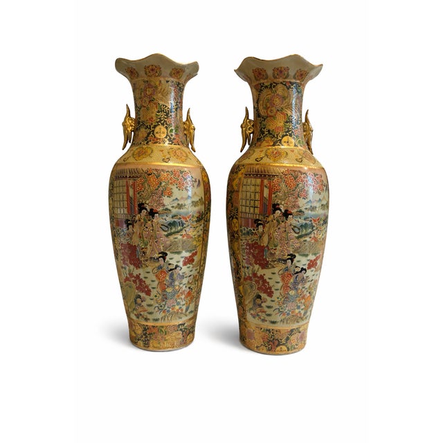 Striking pair of tall Chinese export porcelain vases featuring a beautifully ruffled rim and elegant gilt animal-form side...