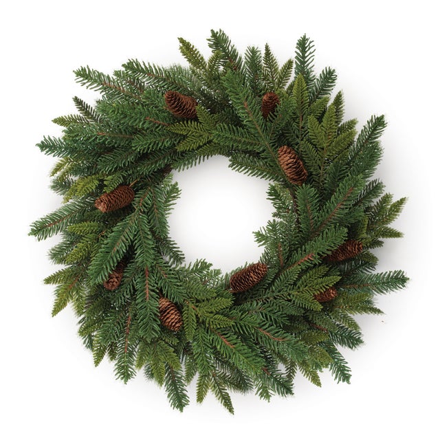 Welcome the season with the natural beauty of this Pine and Pinecone Wreath. Featuring full, layered evergreen branches...