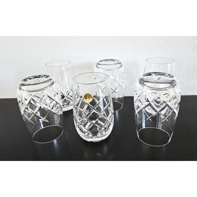 A striking and pristine set of six (6) vintage cut-crystal tumblers from the renowned West German heritage maker...