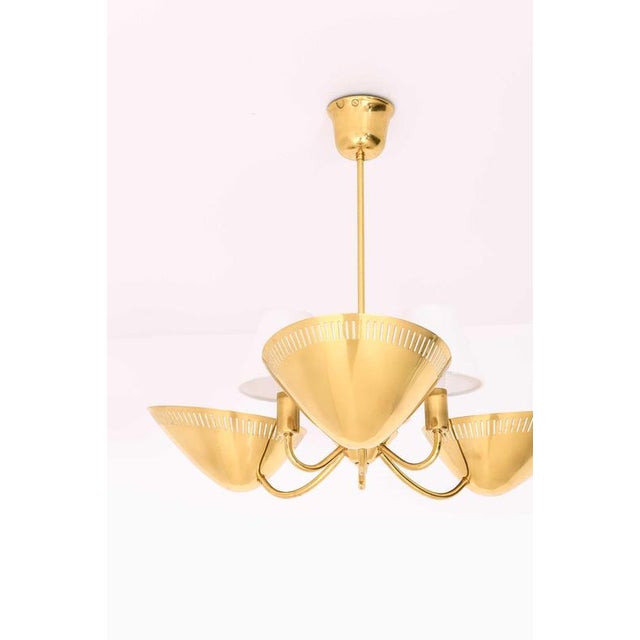This very rare ceiling lamp, designed by an unknown maker and produced in Norway, is a refined example of mid-century...
