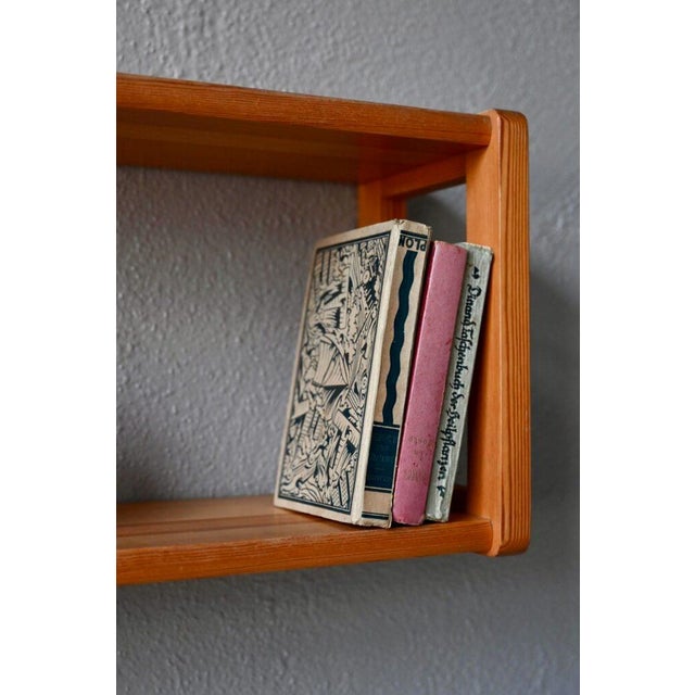 with its minimalist yet strikingly effective lines, this pine wall shelf is both elegant and understated. Vintage in...