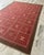 Beautiful large vintage Swedish Rug from circa 1940/50s. A red/pink base with a brown border and geometric designs in...