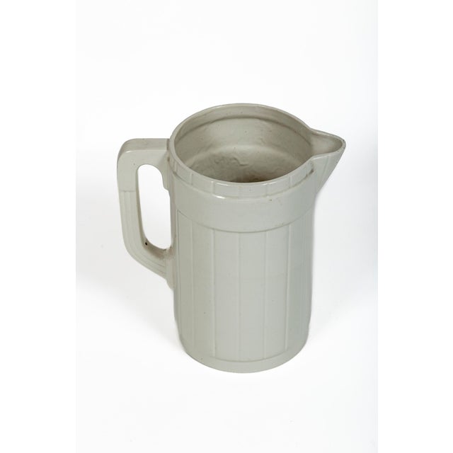 Vintage White Ironstone Pitcher by Auguste Moulin et Cue, circa 1920's. Heavy ribbed design. Marked on bottom, 'Made in...