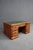 A distinctive cherry-finished coffee table modeled after a traditional partners desk. This substantial piece features a...