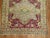 One of a kind rare original size antique Sivas rug with a raspberry colored ground and gray medallion and border with...