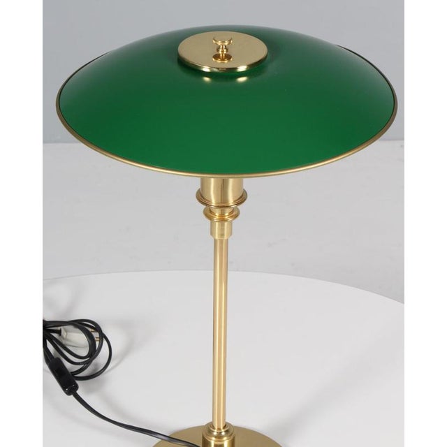 Poul Henningsen PH 3/2 with green lacquered brass shades. Base in brass. Annivesary edition from the 1990s This piece is...