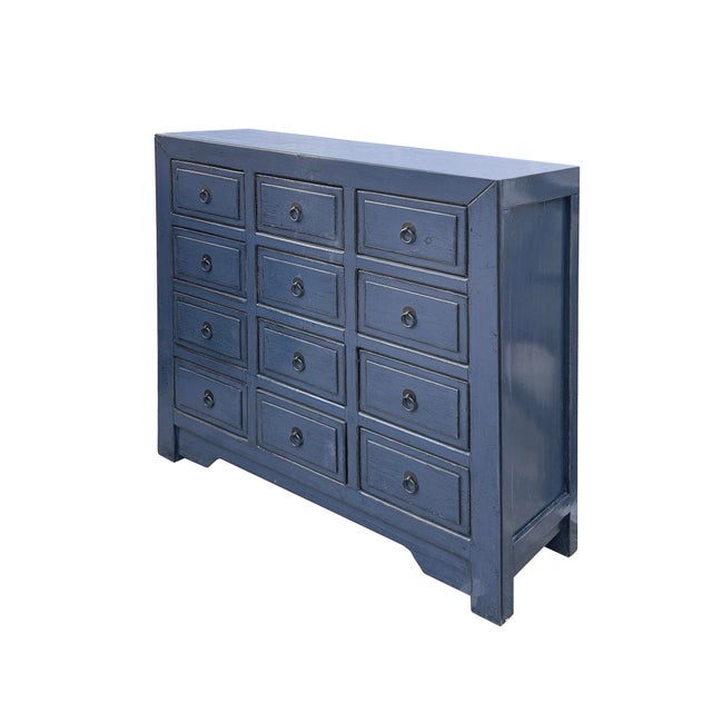 This striking blue purple hue dresser exudes a timeless elegance with its rich, deep blue finish and classic design....