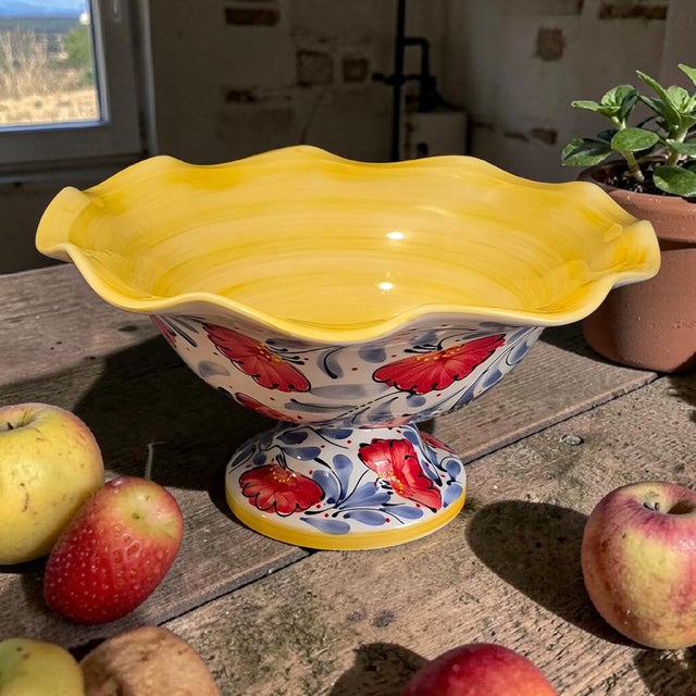 The Footed Scalloped Edge Spanish Pottery Painted Enamel Poppies Center Piece Bowl by Pedraza Ceramica is a beautifully...
