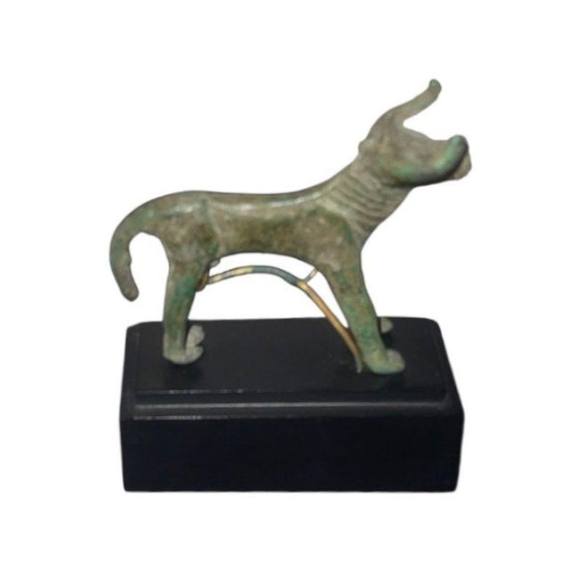A charming and highly evocative Greek Archaic bronze bull, created during the early centuries of classical Mediterranean...