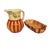 This vibrant hand-painted ceramic set features a classic pitcher (8"x8") and a matching wavy-edged dish (11"x6") adorned...