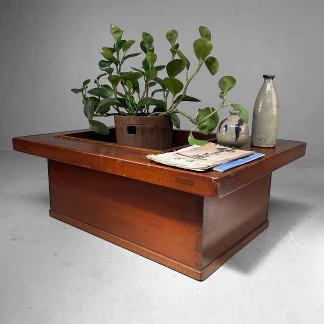 A simple yet elegant hibachi table from the Taishō period, crafted from warm-toned wood with a beautifully visible grain...