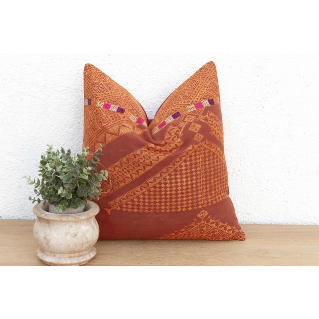 This 18-inch square pillow is a luminous example of Antique Phulkari craftsmanship, repurposed from a single, 19th-century...