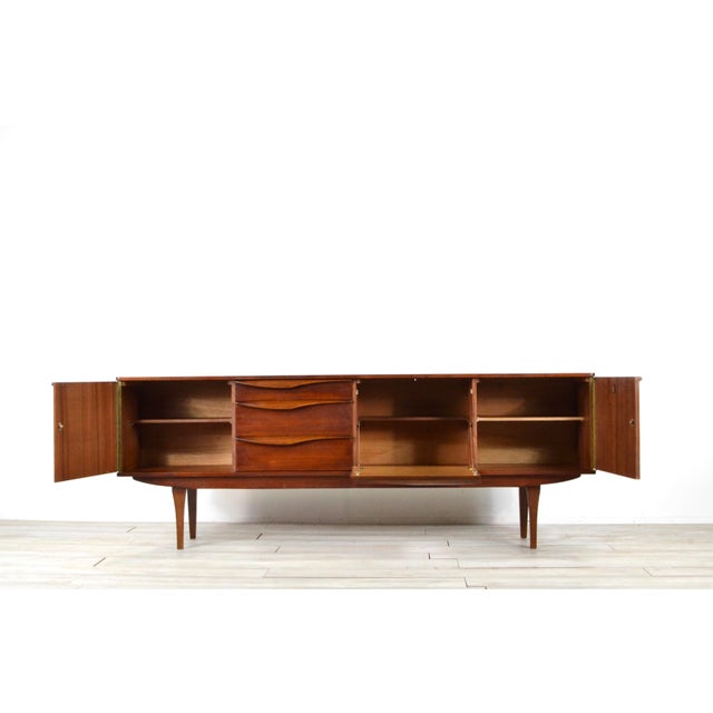 Long John Sideboard in Teak from Stonehill, 1960s, in Very Good conditions. Designed 1960 to 1969 This piece has an...