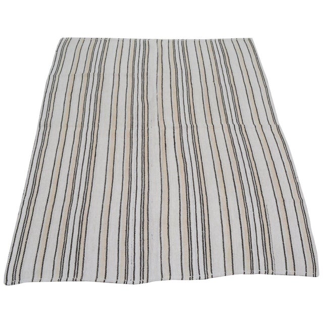 Hand-knotted with care using traditional rug-making techniques, this wool rug blends timeless craftsmanship with a modern...