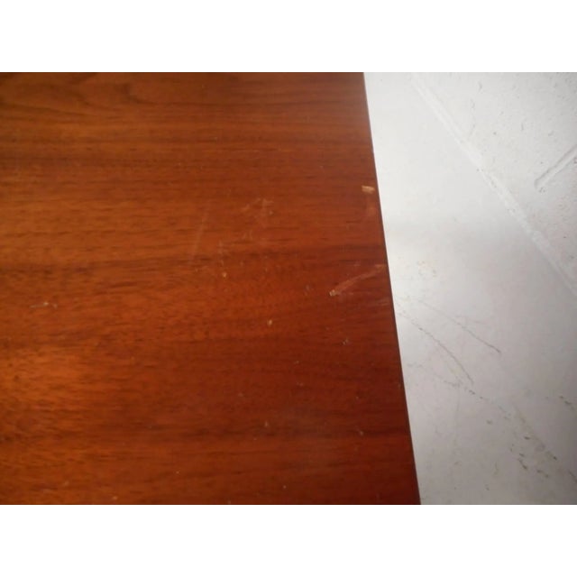 This gorgeous vintage modern desk features a unique raised top along the back and sculpted feet. Sleek design with unusual...