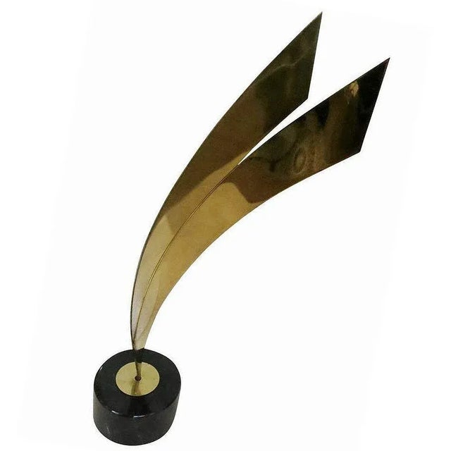 Tall brass abstract table sculpture on marble base by Curtis Jere, circa 1984. Vintage This large abstract metal...