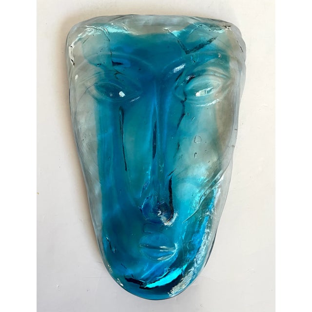 Here is a beautiful face mask made of blue and transparent glass. It has a wonderful modern feel and would be great as a...