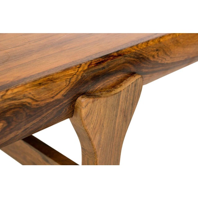 Origin: Denmark Designer: Johannes Andersen Manufacturer: Uldum Era: 1960s Materials: Rosewood Measurements: 62.5″ wide x...